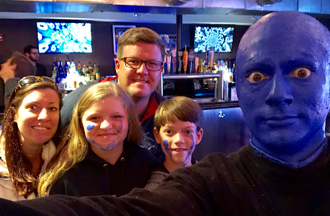 Boston to Niagara Falls road trip itinerary featured by top US family travel blog, More than Main Street: image of Blue Man Group in Boston, Massachusetts.