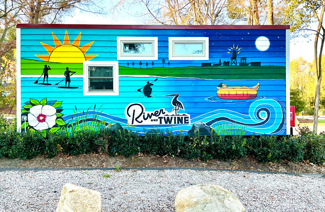 River and Twine tiny house hotel mural featured by top US family travel blog, More than Main Street.