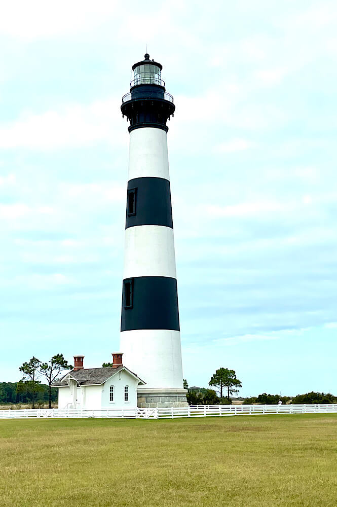 Visiting Bodie Island Lighthouse is one of the best things to do in Nags Head NC featured by top US family travel blog, More than Main Street.