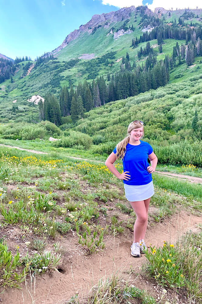 Teenager girl hiking in Utah Wasatch Mountains- Alta Ski Resort.