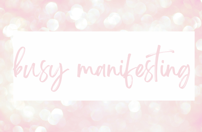 Pink sparkly background with text that reads "Busy manifesting"